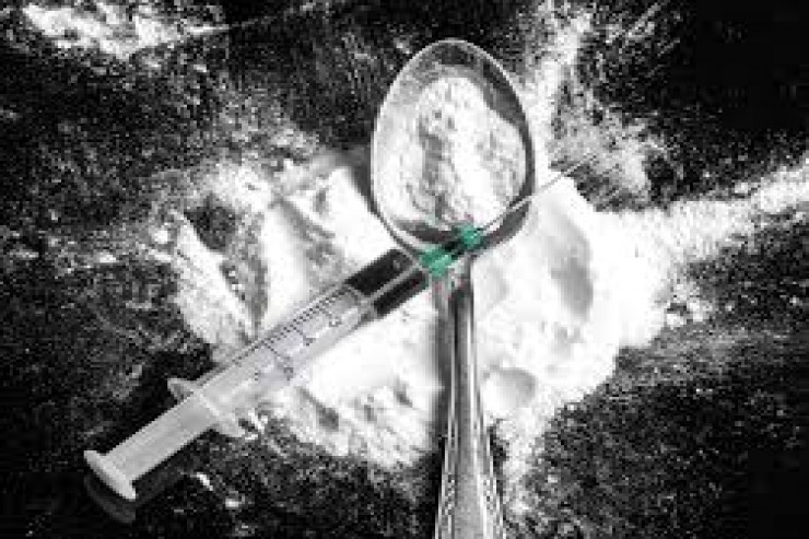 "Bandotdel" evdən 11 kilodan çox heroin tapdı